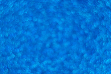 Blue shiny background. Bokeh. Glitter. The side with sequins. Classic blue. Magic