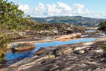 Fototapeta na wymiar Rio do Lajeado, with small lakes, rock formations, mountains and savannah, Milho Verde, Serro district, Minas Gerais, Brazil