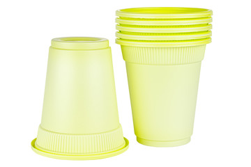 Upside down one and standing five in set unused green disposable cups made of biodegradable materials isolated on white background