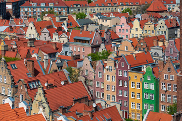Fototapeta na wymiar Rooftops and vivid facedes of houses in historical center of Gdansk, Poland