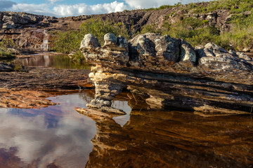 Small lake, with interesting rock formations, at Lajeado waterfall in Milho Verde, Serro district, Minas Gerais, Brazil