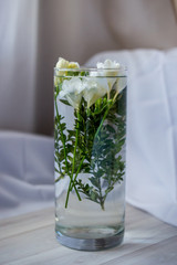 white freesia flowers in a glass
