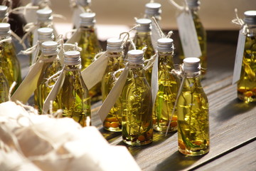 small bottles with oil, twigs and berries
