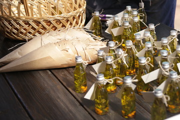 small bottles with oil, twigs and berries