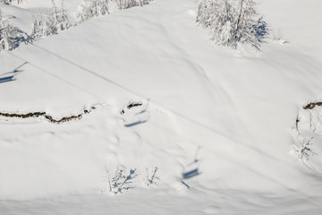 skiers in the mountains