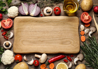 Fototapeta na wymiar Flat lay composition with fresh products on wooden table, space for text. Healthy cooking