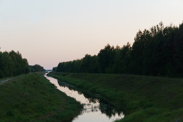 A small river flows from the lake.