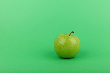green apple on green background