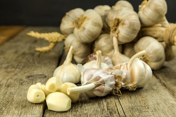 Garlic on kitchen table. Healthy ingredients for food. Traditional flu treatment. Garlic when preparing food. Spices against flu.