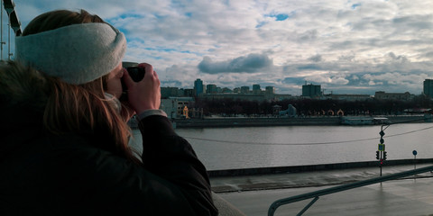 Woman taking picture. Moscow, Russia. Landscape.