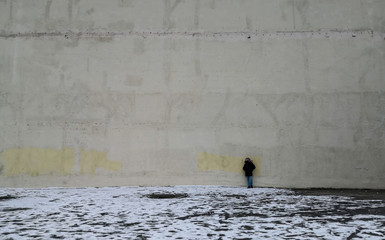 Man on the wall. Winter in Moscow, Russia. Snow.