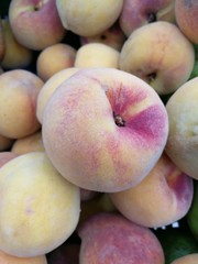 Group of fresh peaches in the market.