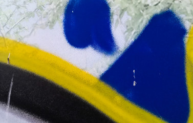 spray paint texture background. Blue, yellow and black.