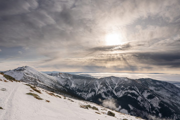 Fototapeta na wymiar Beautiful clouds in winter landscape in mountains of Slovakia, Slovakia Low Tatras