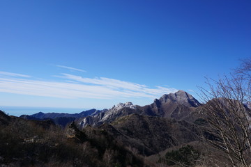 View of the Apuan Alps with a peak cut due to the extraction of white marble