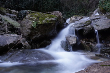 Water flows into a mountain river