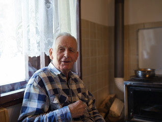 Portrait of senior man at home