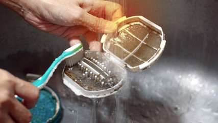 Cleaning The Debris Filter In Washing Machine With Brush