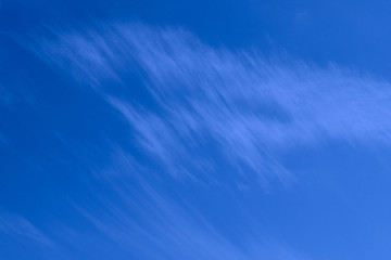 Blurry image of cloudy sky. Blue sky and white clouds. Colorful nature background.