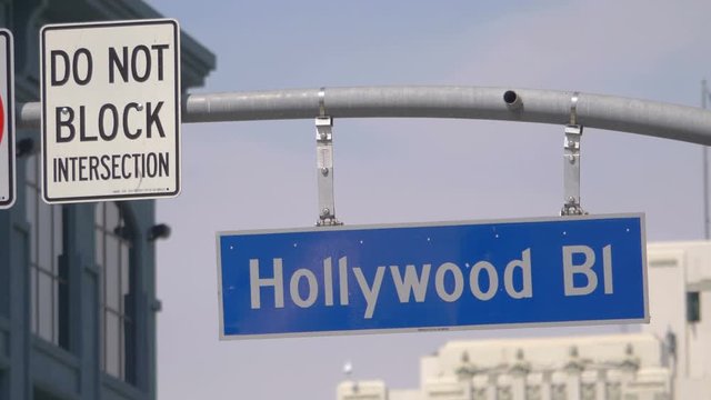 Hollywood boulevard street sign and traffic lights in 4k in slow motion 60fps