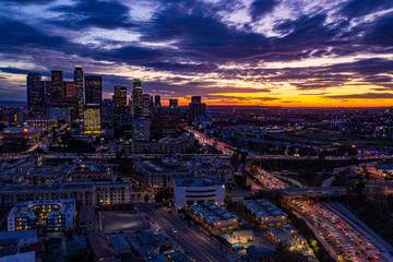 Fototapeta premium Downtown LA Sunset From Behind Looking South Aerial Los Angeles