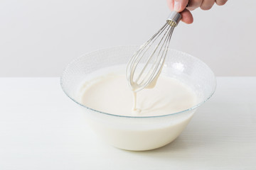 Fototapeta na wymiar dough in glass plate on white background