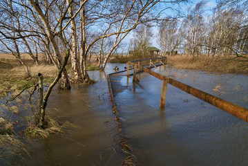 Storm-flooded plank path in the floating moor (German: Schwimmendes Moor) in Sehestedt (municipality of Jade, district of Wesermarsch, Germany) on 10th February 2020