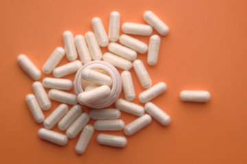 top view of capsule on color background