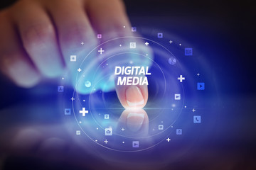 Finger touching tablet with social media icons and DIGITAL MEDIA