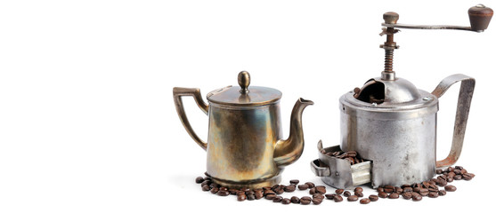 Vintage coffee pot, grinder coffee and beans isolated on white background. Free space for text....