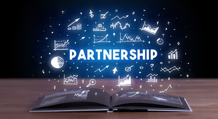 PARTNERSHIP inscription coming out from an open book, business concept