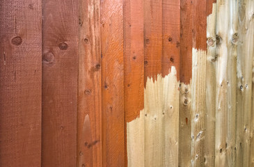 Part painted wooden fence panel showing before and after. No people