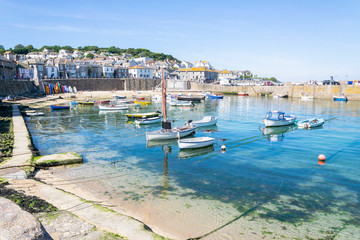 Mousehole Harbour, a picturesque Cornish fishing village near Penzance in Cornwall, England