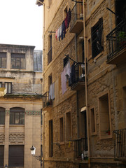 Laundry hanging from balconies in the streets of San Sebastian
