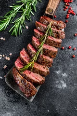 Tuinposter Grilled top blade, Denver steak. Marble meat beef. Black background. Top view © Vladimir
