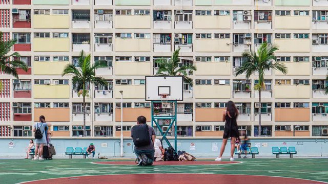 Timelapse of lots of tourist / hipster come to visit and take photos at Choi Hung Estate rainbow colored building for their social media, Hong Kong, July 2019