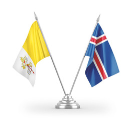 Iceland and Vatican table flags isolated on white 3D rendering