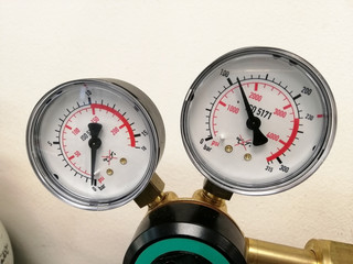 Hydraulic Pressure Gauges. pressure gauge on a gas regulator in a laboratory analytical equipment.