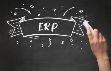 Hand drawing ERP abbreviation with white chalk on blackboard
