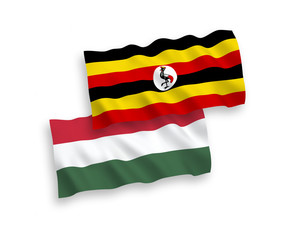 Flags of Uganda and Hungary on a white background
