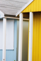 Abstract view of Beach huts. Sutton on Sea beach hut juxtaposition of colours and structure of huts. Various colours in vivid shades and brightness. Summertime holiday resort.