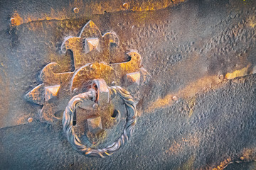 medieval iron door with forged steel door handle