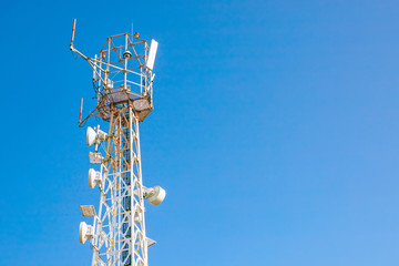 tower with mobile operator antennas  on the background sky