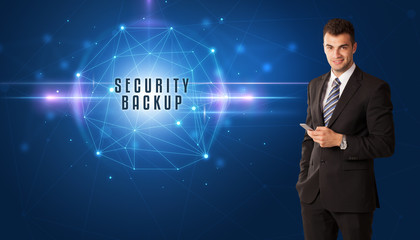 Businessman thinking about security solutions with SECURITY BACKUP inscription