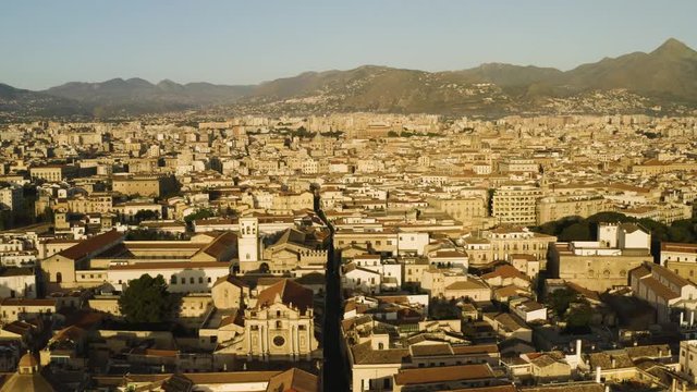 Flight in the historic part of Palermo, early sunny morning over the Corso Vittorio Emanuele, Cattadrale Santa Vergine Maria Assunta, Palazzo dei Normanni. Sicily, Italy. May 2019. Aerial shot