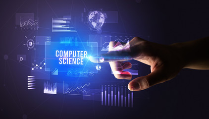 Hand touching COMPUTER SCIENCE inscription, new business technology concept