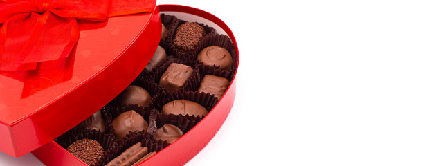 A Red Love Heart Box of Valentines Chocolates Isolated on a White Background