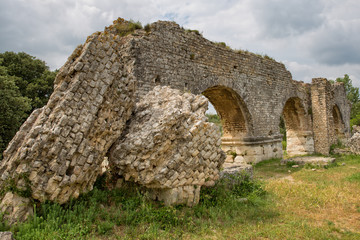 The Historical Monument Aqueduct Romain de Barbegal. The Barbegal aqueduct and mills constitute a Roman complex of hydraulic milling located in Fontvieille, near the town of Arles, Provence, France