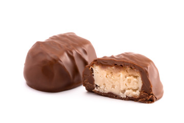 A Chocolate Coconut Truffle Cut Open and on a White Background