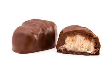 A Chocolate Coconut Truffle Cut Open and on a White Background